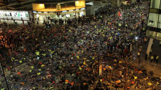 Over 1,000 cyclists lay on the ground outside the office of TfL 